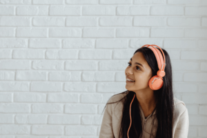 teen listening to music as a coping skill after online teen therapy