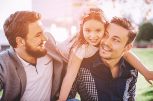 two dads learning got navigate co-parenting with their daughter after parenting therapy in Simi Valley, ca