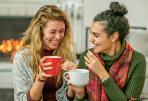 two friends enjoying coffee together after one of them set boundary that she can only gossip for an hour after learning this skill in anxiety therapy in Simi Valley, ca