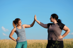 two friends reaching fitness goals together and inspiring each other after they both are in anxiety therapy and want to support each other more