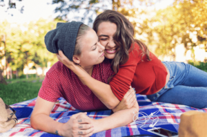 young lesbian couple having a picnic and enjoying their time together after a successful couples counseling in Simi Valley appointment