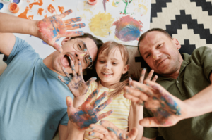 fathers and daughter hanging out and having fun painting together after lgbtqia therapy near Simi Valley, ca