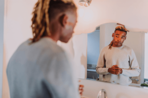 man looking in the mirror and recognizing that he has grown a lot thanks to individual therapy in Simi Valley, ca