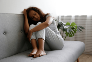 woman on couch feeling fed up with the way her life is going decides its time to take action and seek out anxiety therapy in Simi Valley, ca