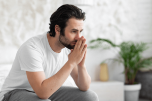 man is starting to learn how to sit with discomfort thanks to anxiety therapy