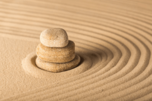 a picture of stones in sand to emulate calmness, such as in anxiety therapy in simi valley, ca