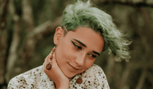 queer femme with green hair after meeting with Simi Valley therapist
