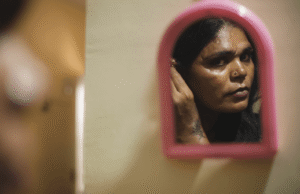 transgender woman looking in the mirror after Simi Valley LGBTQIA therapy